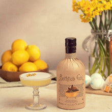 Load image into Gallery viewer, Bottle of Bathtub Gin with a cocktail and lemons on a table