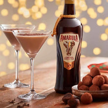 Load image into Gallery viewer, Amarula cream liqueur bottle with two glasses of chocolate cocktail and truffles on a wooden surface.