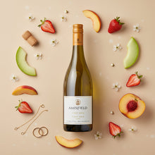 Load image into Gallery viewer, Amisfield Pinot Gris wine bottle surrounded by fruit and flowers on a beige background