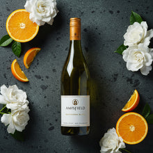 Load image into Gallery viewer, Amisfield Central Otago Sauvignon Blanc wine bottle with oranges and white flowers on a dark surface