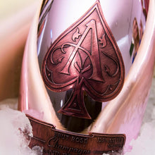 Load image into Gallery viewer, Champagne bottle with a spade logo on a bed of ice