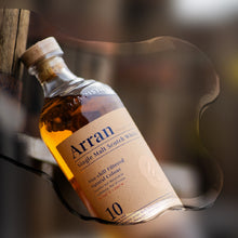 Load image into Gallery viewer, Arran Single Malt Scotch Whisky bottle with a blurred background