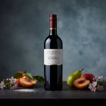 Load image into Gallery viewer, Bottle of Ata Rangi Celebre red wine with fruits and flowers on a dark surface