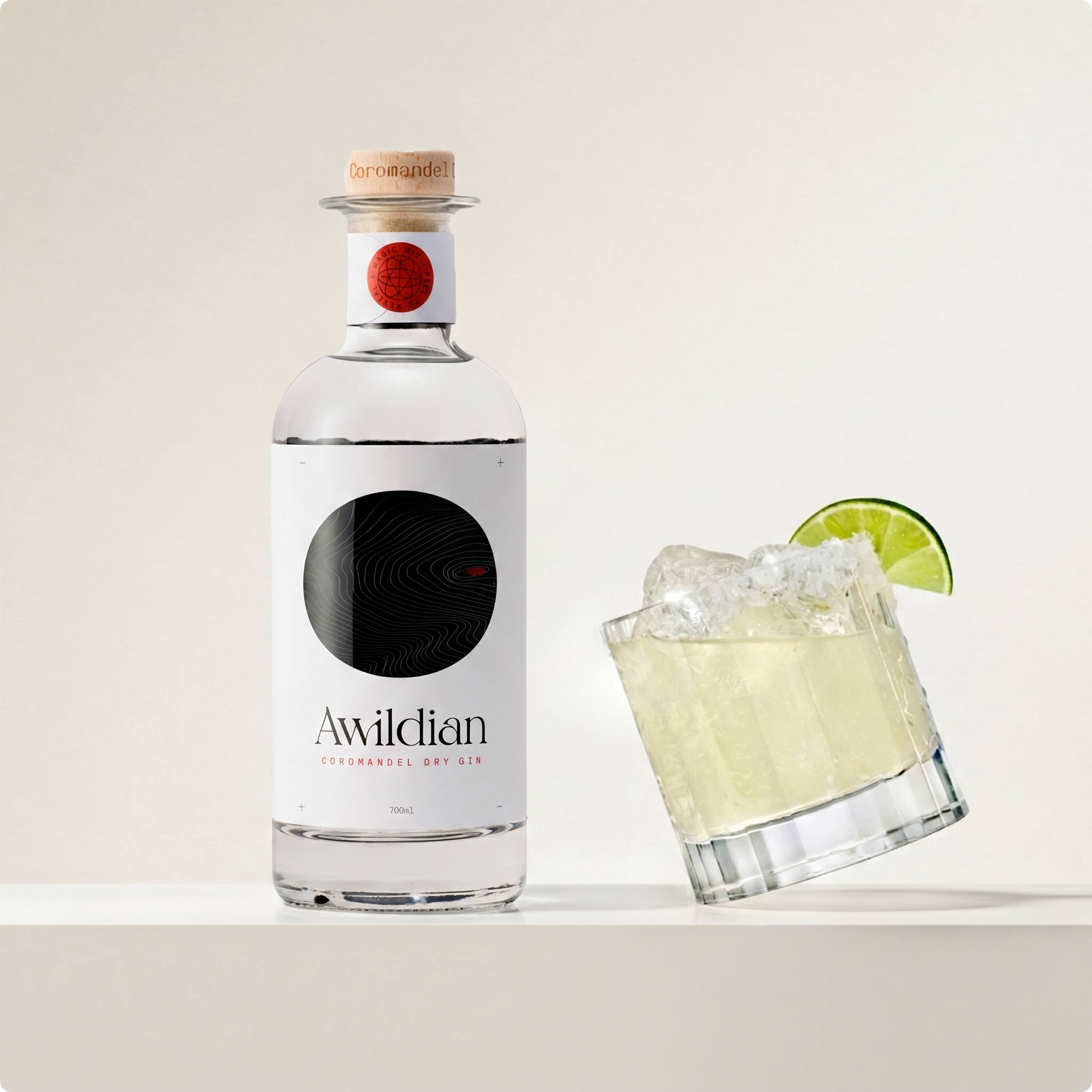 Load image into Gallery viewer, Awildian dry gin bottle with a glass of gin and tonic on a white background