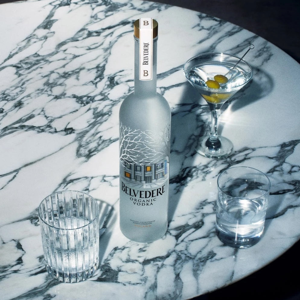Load image into Gallery viewer, Bottle of Martini on a marble surface with glasses