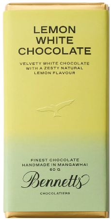 A bar of Bennetts Lemon White Chocolate with a yellow packaging, labeled as 'finest chocolate handmade in Mangawhai 60g'.