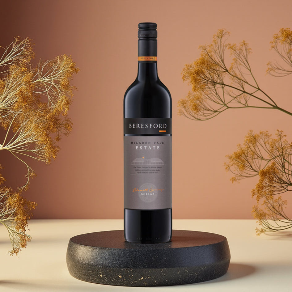 Beresford Estate Shiraz wine bottle on a wooden stand with dried plants in the background