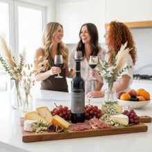 Load image into Gallery viewer, Three women enjoying a bottle of Beresford-Estate-Shiraz wine and a charcuterie board in a kitchen setting.