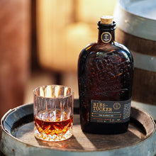 Load image into Gallery viewer, Bottle of Bib and Tucker 6 Year Old Tennessee Bourbon and a glass on a wooden barrel with a blurred background