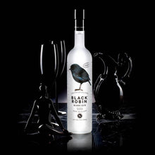 Load image into Gallery viewer, Black Robin Rare Gin bottle with decorative elements on a black background
