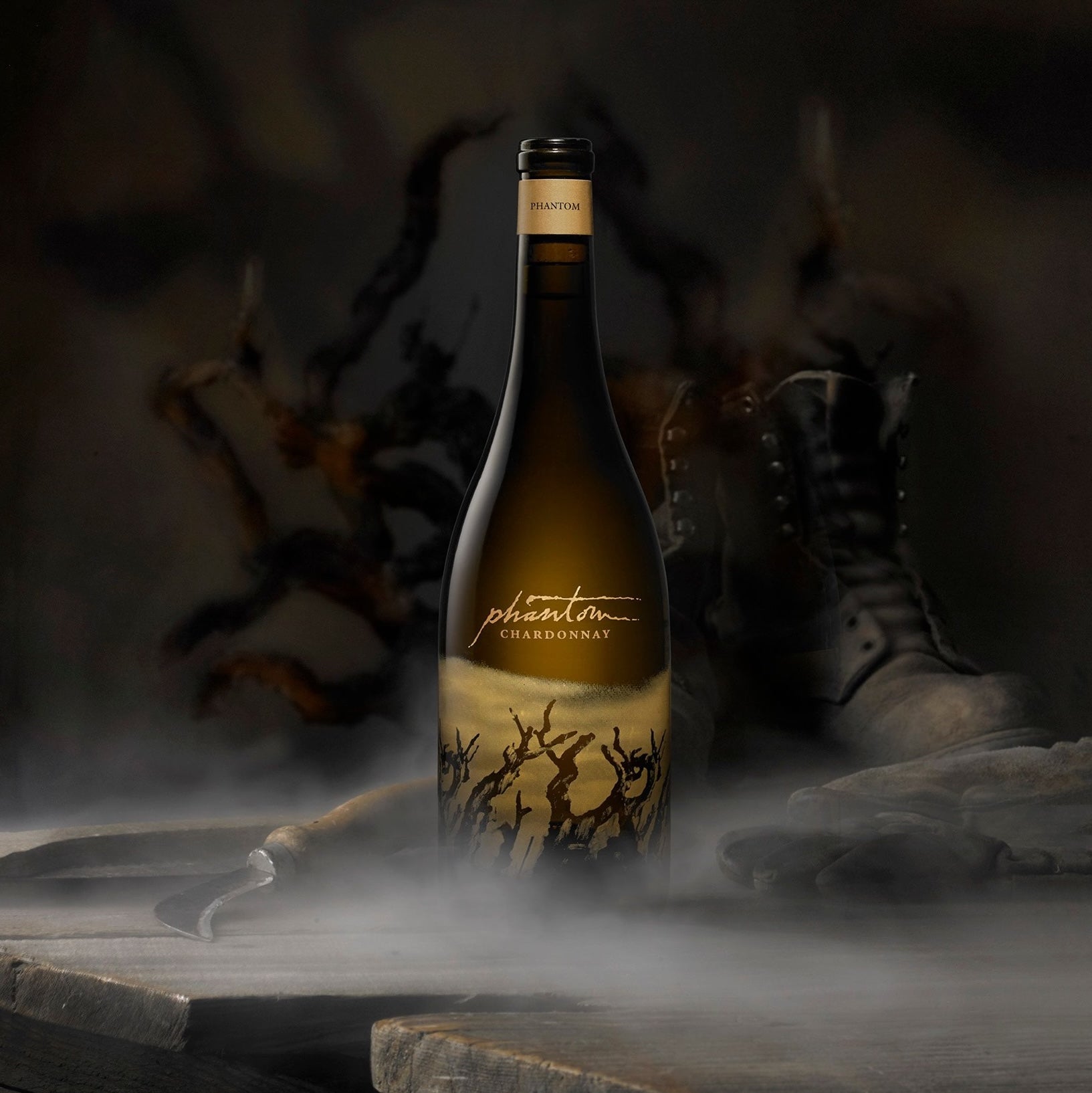 Load image into Gallery viewer, A bottle of Bogle Phantom Chardonnay on a wooden table with a misty background