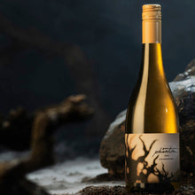 Load image into Gallery viewer, Wine bottle with unique label on a dark, textured surface