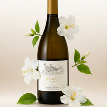 Load image into Gallery viewer, A bottle of Bogle Reserve Chardonnay with leaves and white flowers surrounding it.