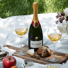 Load image into Gallery viewer, Bollinger champagne bottle with two glasses on a picnic blanket outdoors