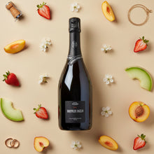 Load image into Gallery viewer, Bottle of Bortolin Angelo Valdobbiadene Brut Prosecco surrounded by fruits and flowers on a beige background