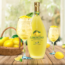Load image into Gallery viewer, Bottle of Bottega Limoncino with two glasses and lemons on a wooden table