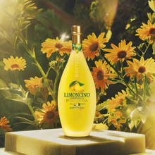 Load image into Gallery viewer, Bottle of Bottega Limoncello with sunflowers in the background