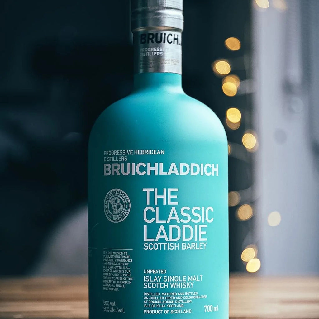 Bruichladdich whisky bottle on a wooden surface with a blurred background