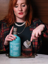 Load image into Gallery viewer, Woman making a Scotch Negroni cocktail using Bruichladdich Classic Laddie Whisky