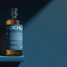 Load image into Gallery viewer, Bruichladdich 18 year old whisky bottle on a shelf with a blue background