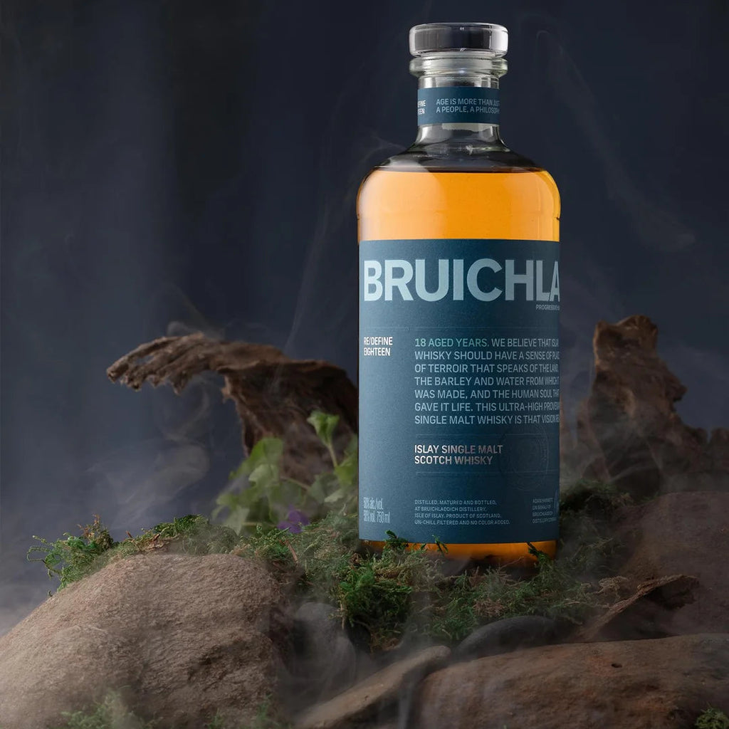 Bruichladdich 18 year old whisky bottle with a mystical background