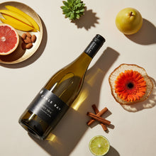 Load image into Gallery viewer, Cable Bay Awatere Valley Pinot Gris wine bottle on a table with fruit and a flower