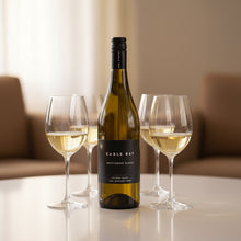 Load image into Gallery viewer, Bottle of Cable Bay Sauvignon Blanc with three glasses of white wine on a table.