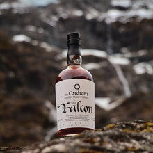 Load image into Gallery viewer, Bottle of The Cardrona The Falcon whisky on a rocky surface with a blurred natural background