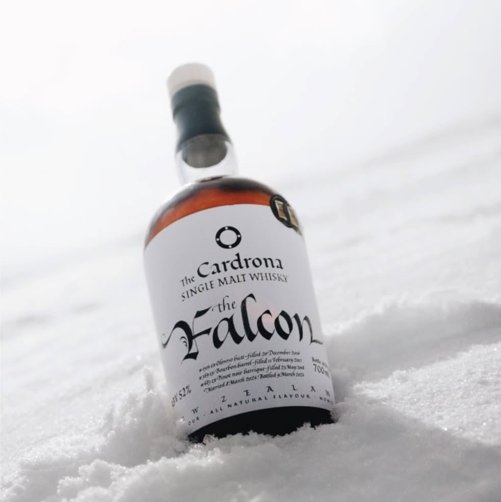 Load image into Gallery viewer, Cardona whisky bottle laying in snow