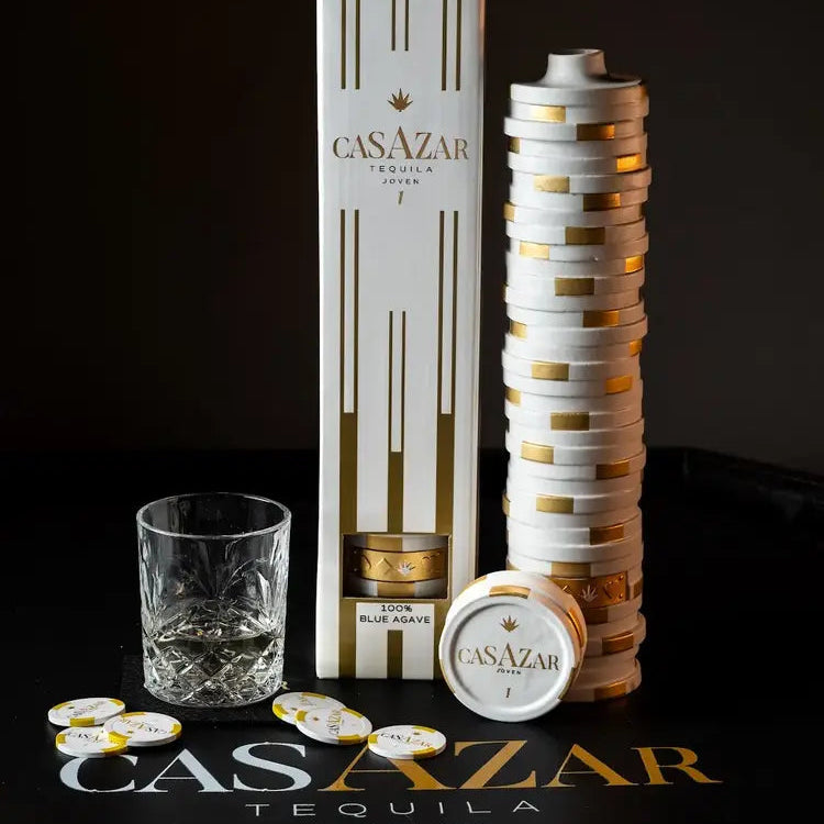 Load image into Gallery viewer, CasAzar Joven Tequila bottle, gift box, and glasses on a dark background