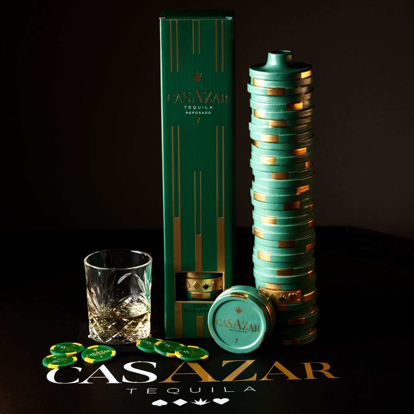 Load image into Gallery viewer, CasAzar Reposado Tequila bottle, gift box, and shot glass on a dark background