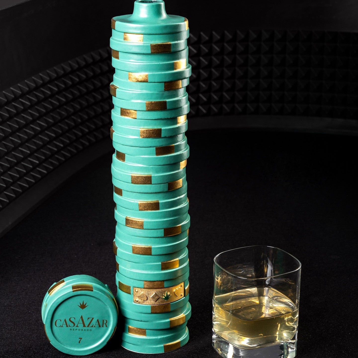 Load image into Gallery viewer, A bottle of CasAzar Reposado Tequila next to a glass of tequila on a dark surface.