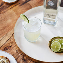 Load image into Gallery viewer, Casa Noble blanco tequila with a margarita on a wooden table
