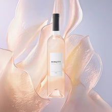 Load image into Gallery viewer, Bottle of Minuty wine surrounded by flowing fabric on a light background