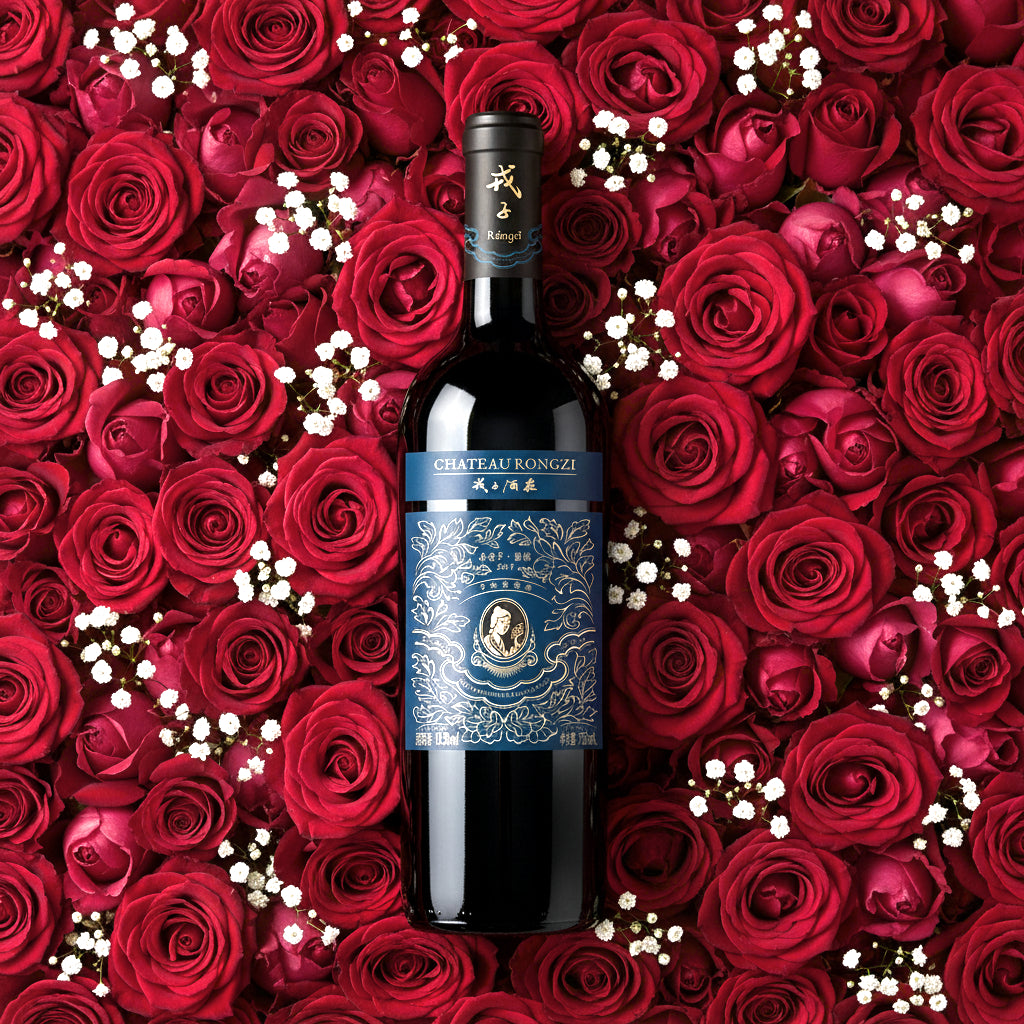 Load image into Gallery viewer, Bottle of Chateau Rongzi Petit Blue Label wine surrounded by red roses