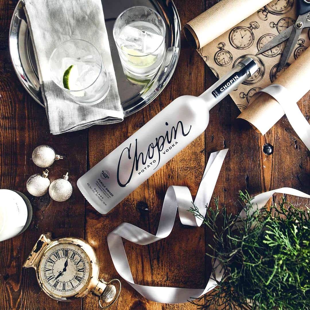 Load image into Gallery viewer, Chopin Potato Vodka bottle on a wooden table with decorative items