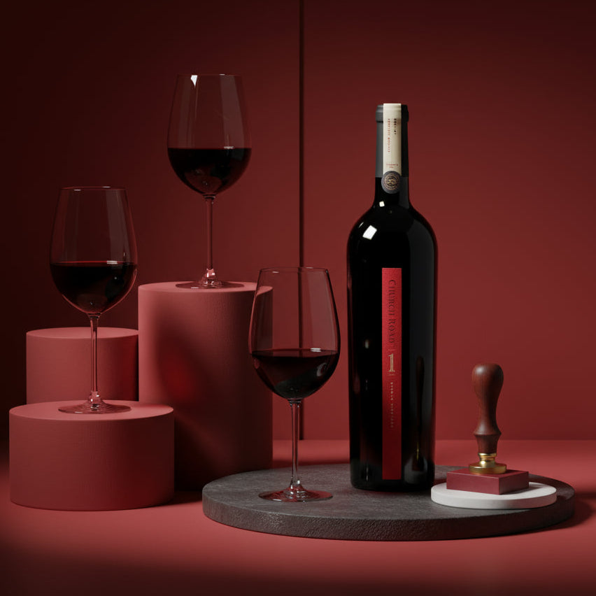 Load image into Gallery viewer, Bottle of Church Road 1 Merlot red wine and glasses on a red background