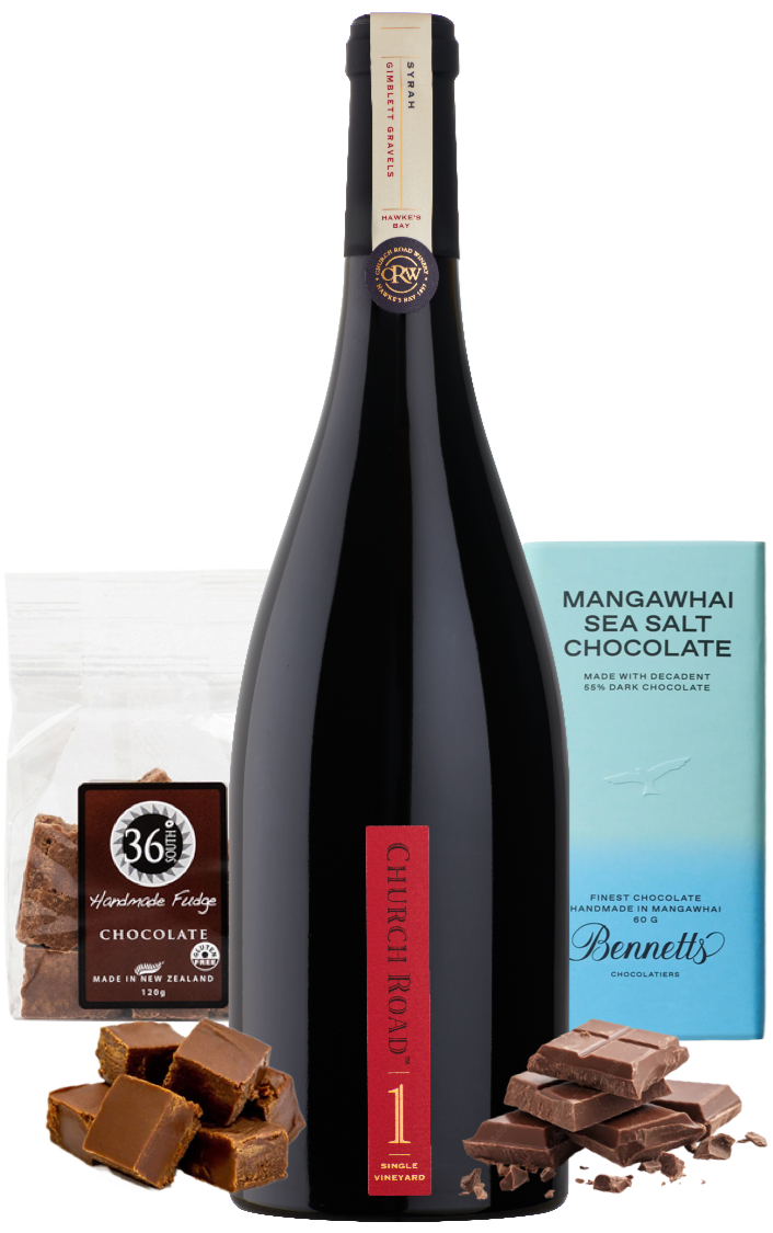 Load image into Gallery viewer, A bottle of Church Road 1 Syrah Red wine centred between packaged chocolate products: a bag of 36 Degrees Handmade chocolate Fudge on the left, a light blue bar of Mangawhai Sea Salt Chocolate by Bennett's on the right, with loose dark chocolate pieces arranged at the base.