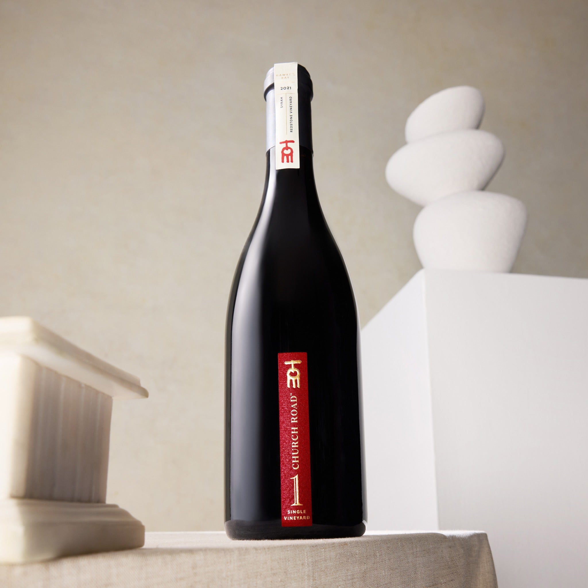 Load image into Gallery viewer, Church_Road_1_Syrah wine bottle with a red label on a neutral background