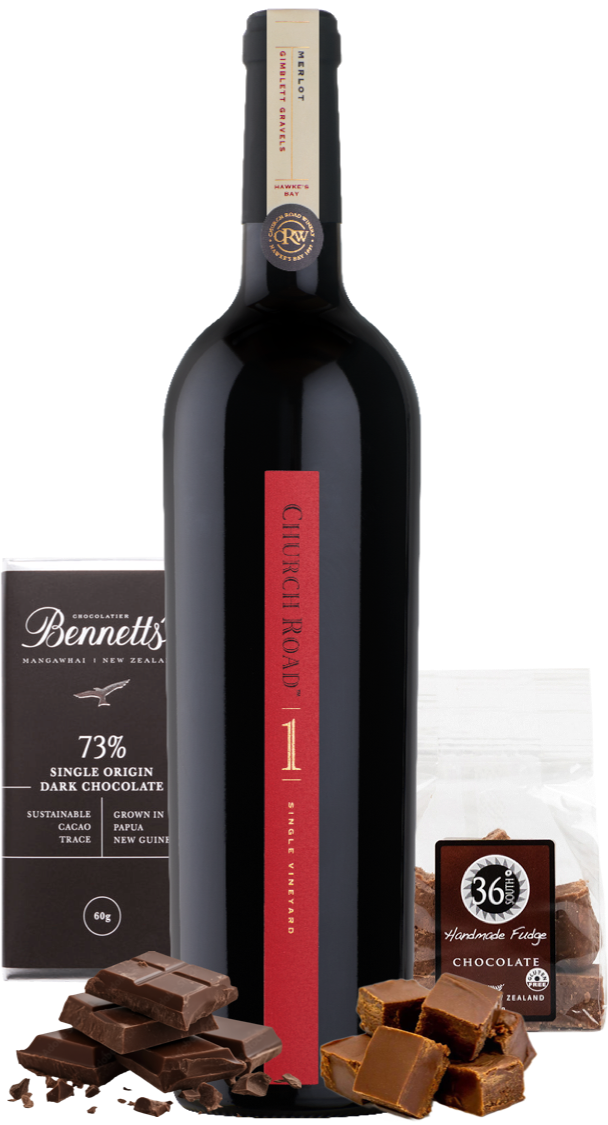 Load image into Gallery viewer, A bottle of Church Road 1 Merlot red wine centred on a white background, flanked by chocolate products: a Bennett's 73% dark chocolate bar on the left, a bag of 36% handmade fudge chocolate on the right, and scattered chocolate pieces at the base.