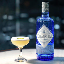 Load image into Gallery viewer, Citadelle gin bottle with a cocktail on a bar counter