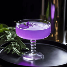 Load image into Gallery viewer, Purple cocktail in a glass with lavender on a dark surface