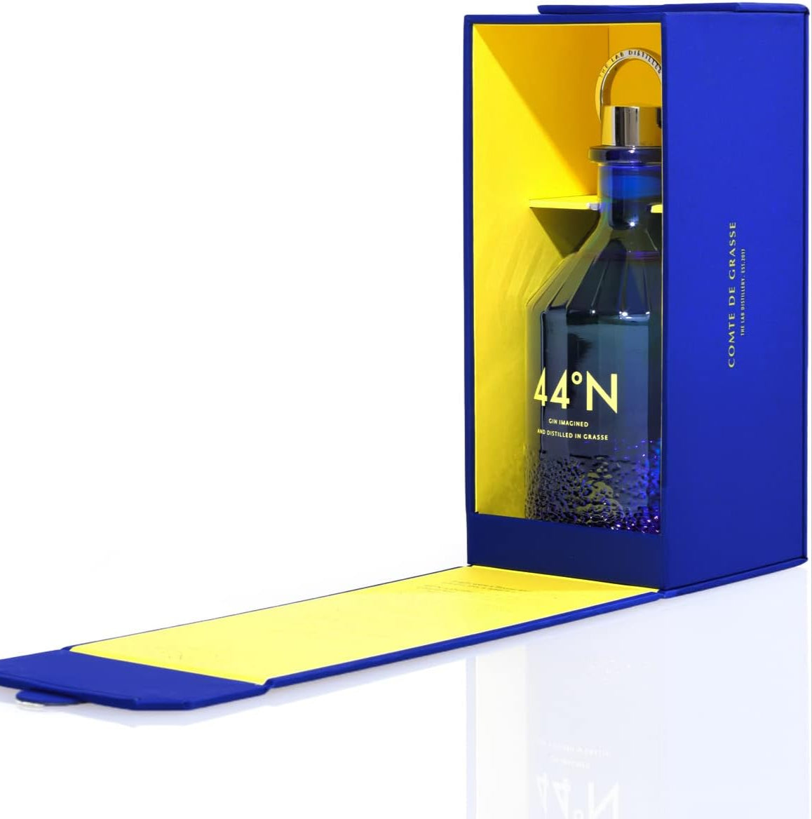 Load image into Gallery viewer, Bottle of Comte de Grasse 44 degrees N Gin in a blue and yellow box on a white background