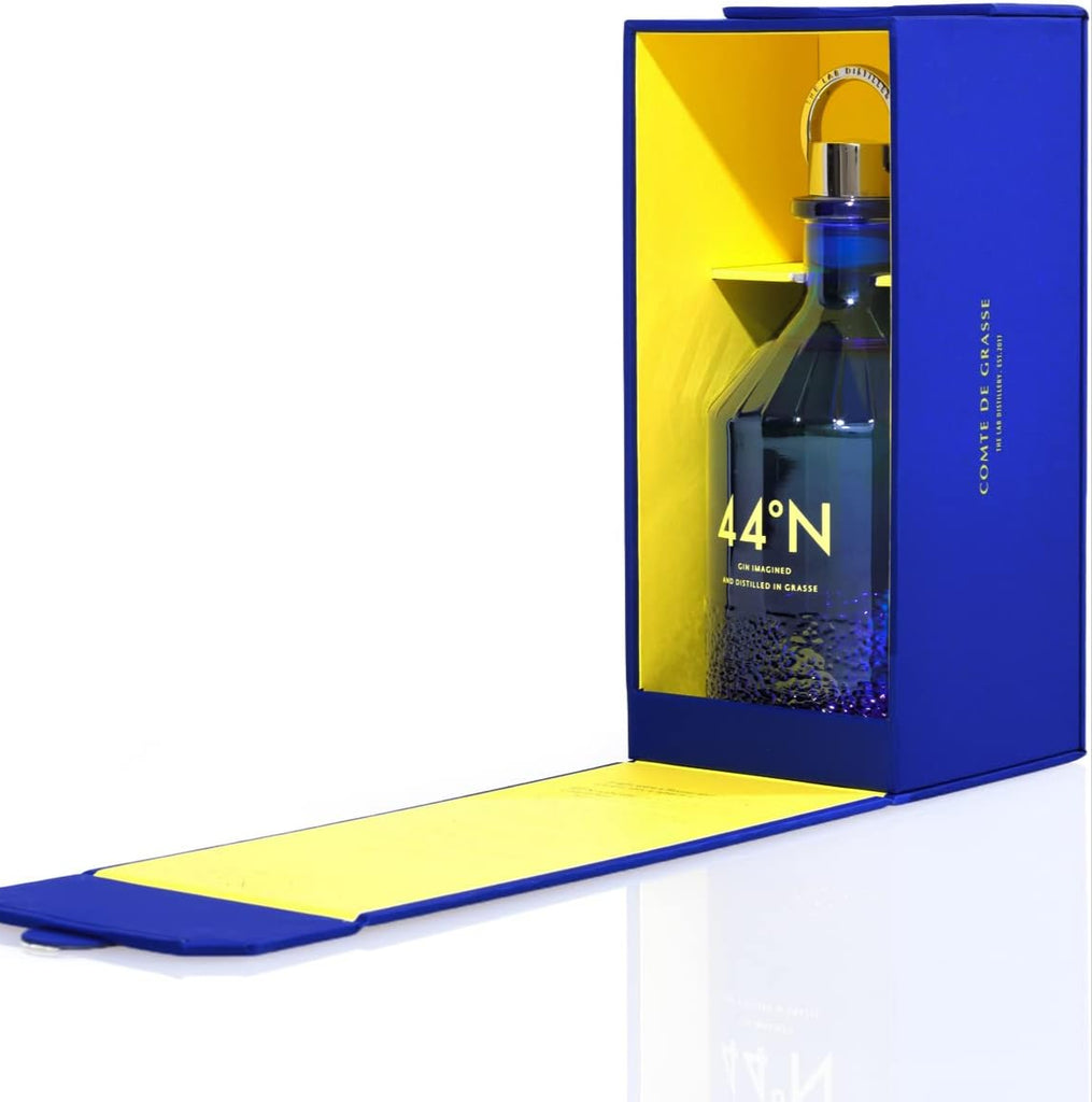 Bottle of Comte-de-Grasse-44-degrees-N-Gin in a blue and yellow box on a white background