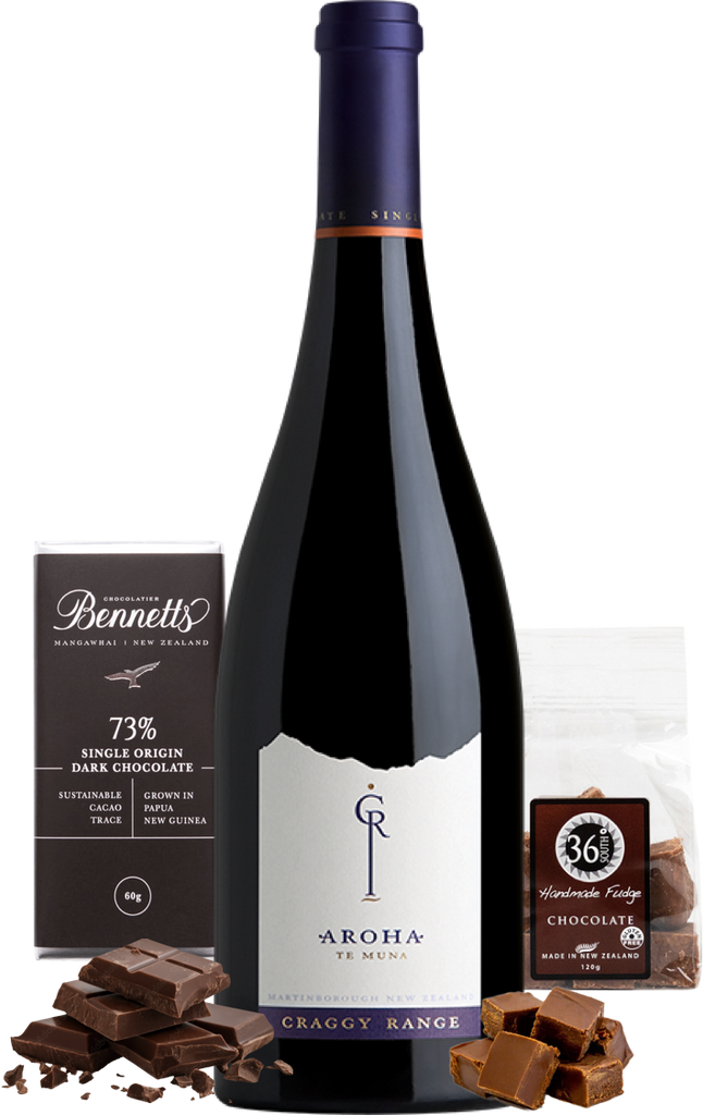 Craggy Range Aroha Pinot Noir wine bottle with chocolate and fudge on a white background