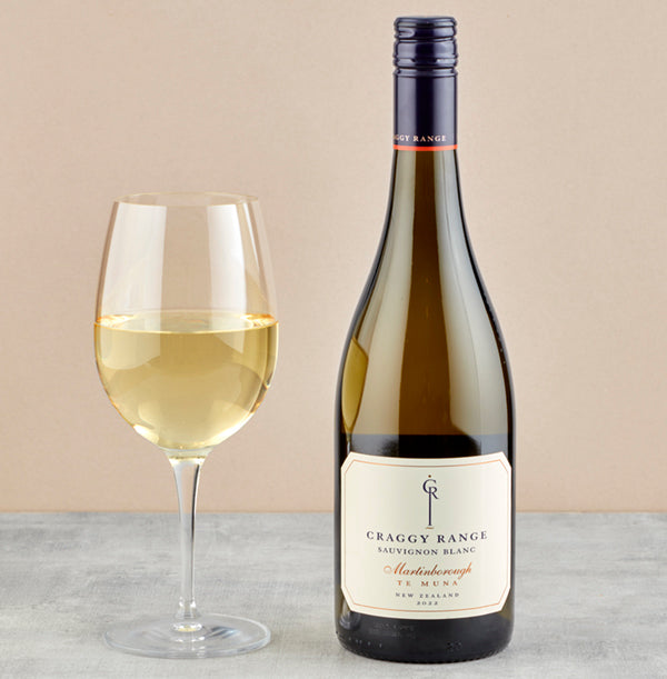 Load image into Gallery viewer, A bottle of Craggy Range Te Muna Sauvignon Blanc on a marble table with a glass