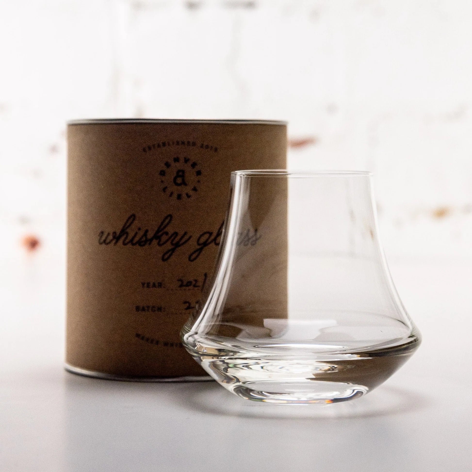 Load image into Gallery viewer, Clear Denver and Liely whisky glass with a brown cardboard box labeled 'whisky glass' on a light background