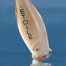 Load image into Gallery viewer, Etoile perfume bottle with reflection on a blue surface