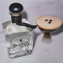 Load image into Gallery viewer, Don Julio 70 Cristalino tequila bottle with a espresso martini cocktail glass on a light gray background