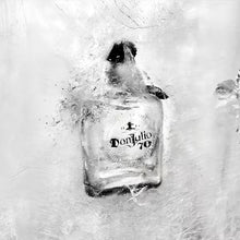 Load image into Gallery viewer, Don Julio 70 bottle frozen in ice with a snowy background